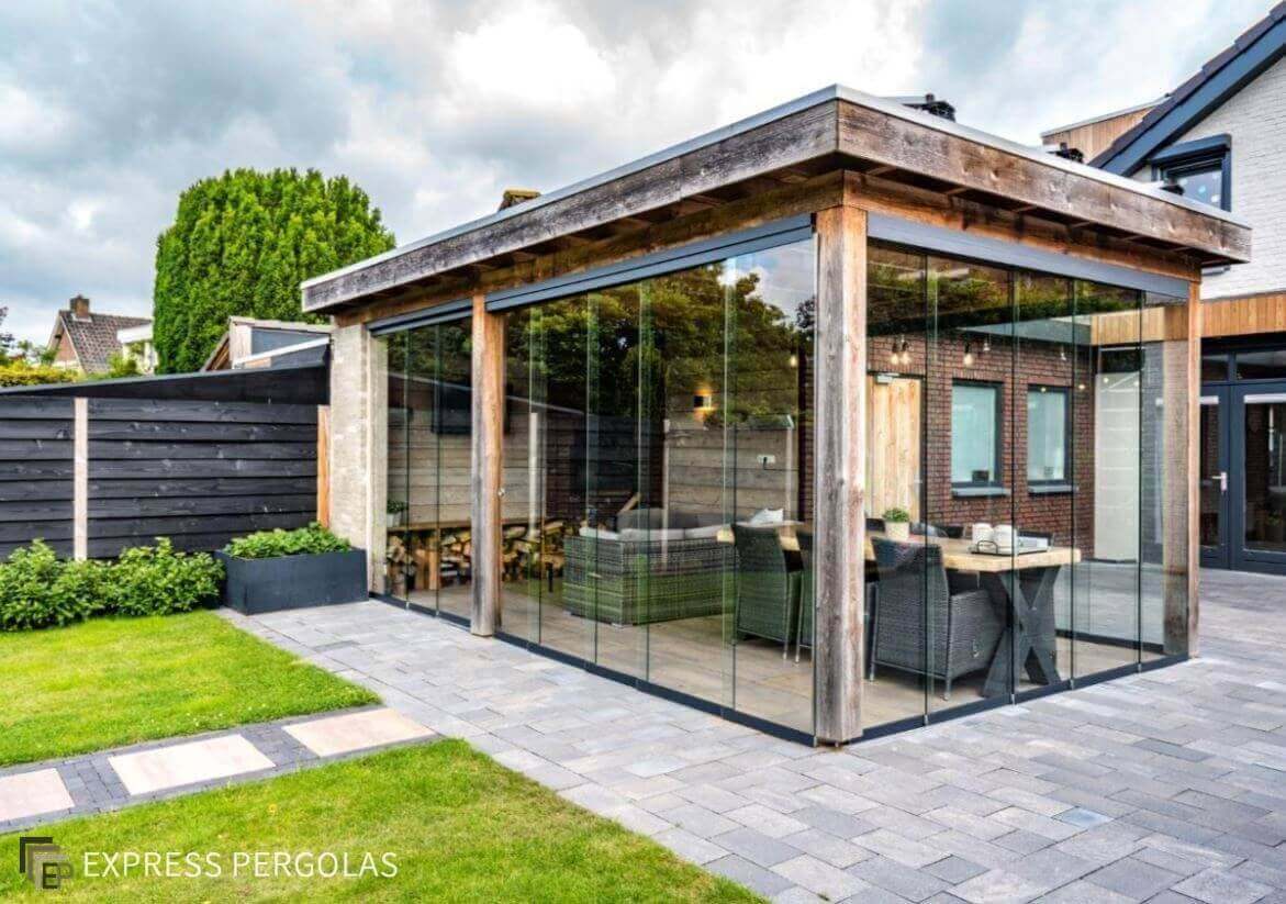 Fiano frameless sliding glass panels enclose this oak garden room