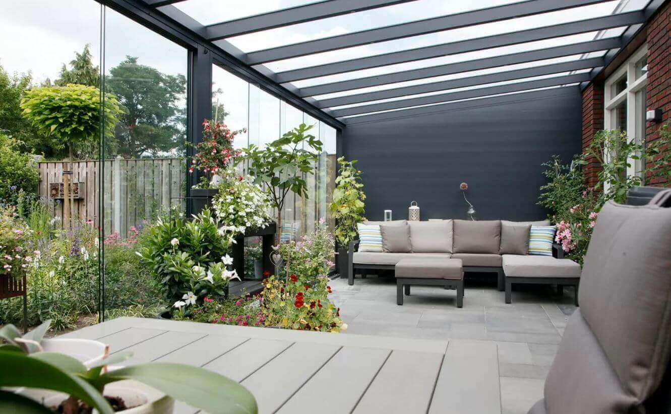 Fiano frameless sliding glass panels enclose this modern veranda